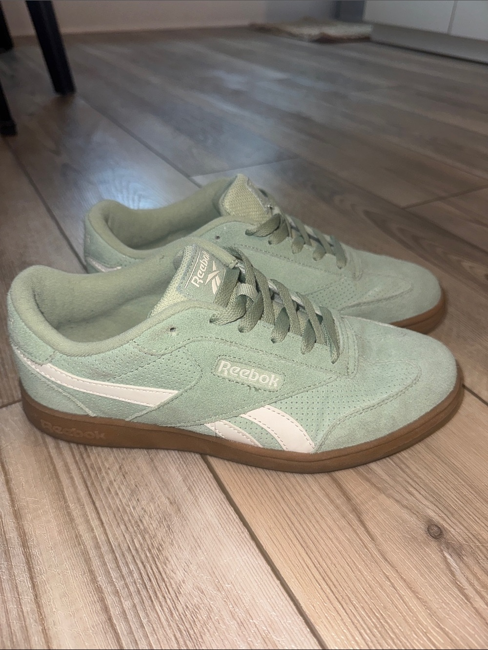 Reebok women’s Mint Green Suede Low-Top Sneakers with White Accents